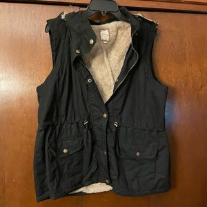 Fur lined black vest from Chic Soul
